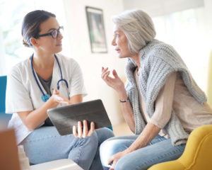 Doctor talking about CCM with woman