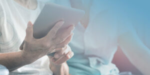 patient taking health risk assessment on tablet
