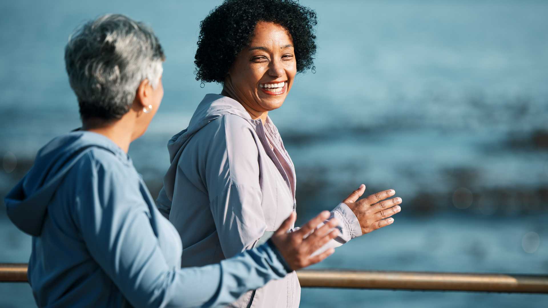 Two older women jogging together